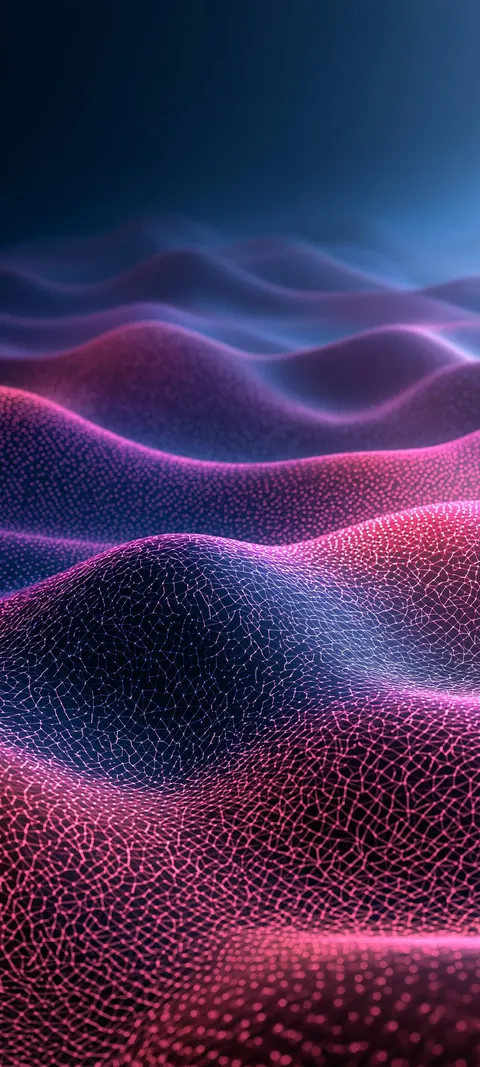 Fine magenta particles gather into soft dune shapes across black, glowing where the light catches the ridges.