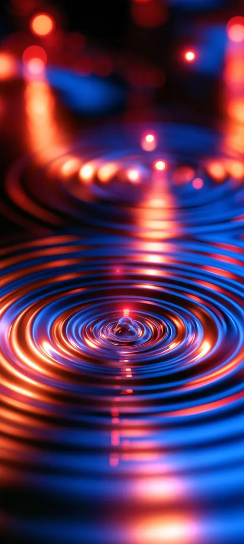 Rings of molten orange light pulse outward across a dark cobalt pool.
