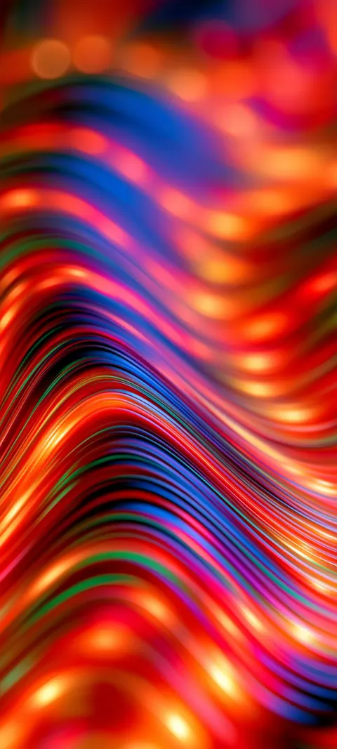 Warm bands of red, orange and gold ripple together in a dreamy, out-of-focus blur.