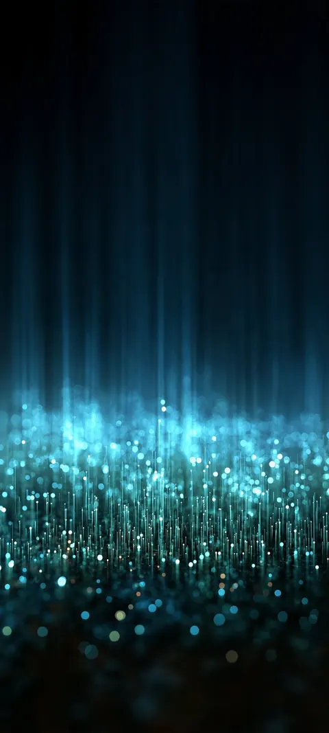 Threads of teal light fall like rain into a shimmering field of sparks.